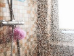 How to Keep Glass Shower Doors Sparkling—No Soap Scum or Streaks