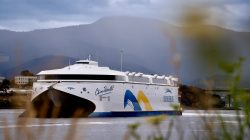Incat’s electric ferry idles in Hobart as heavy-lift ship stalls in Hormuz Strait