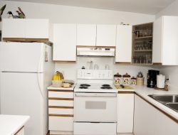 Kitchen cabinets caked in grease get a fresh start with a wallet-friendly fix
